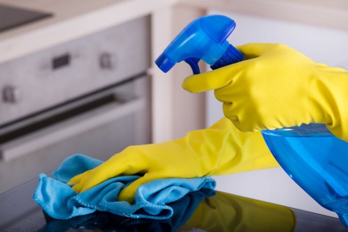 Technician using controlled carpet cleaning methods and protective gear
