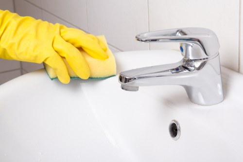 Local cleaners preparing a furnished apartment for final handover in W1S