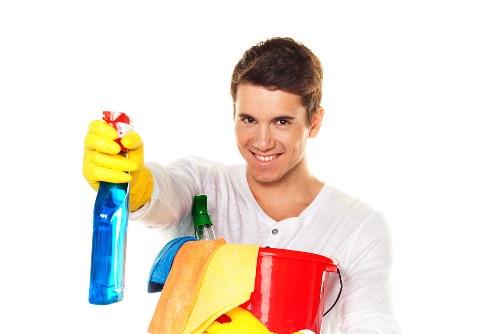 Local technician carrying out oven cleaning in a central London kitchen